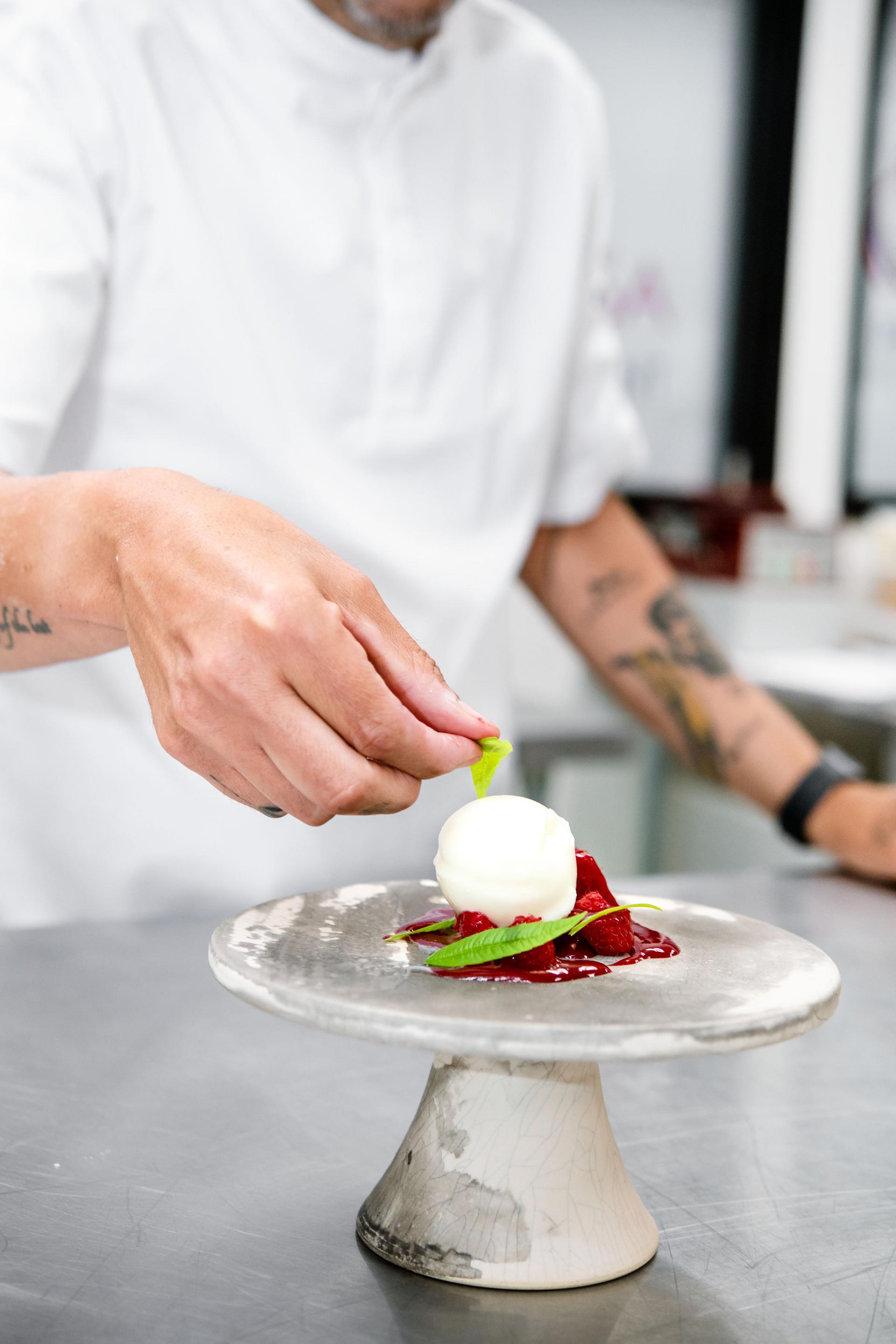 chef preparing a plated dessert