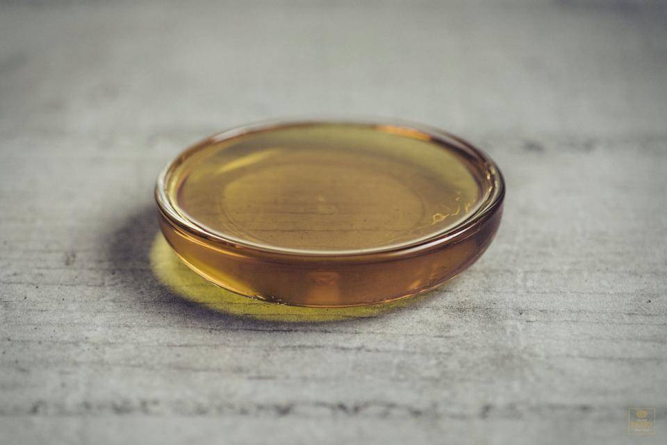 a small glass bowl containing melted cocoa butter