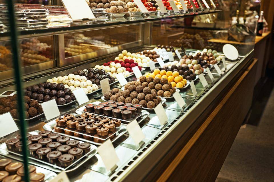 A display case full of chocolate candies and confections