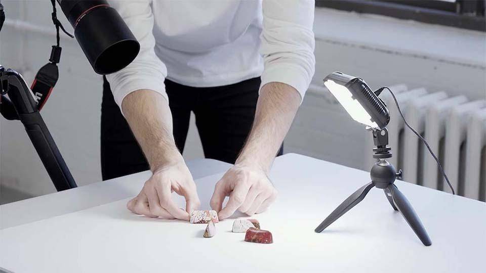 Photographer Keven Poisson arranges bonbons for a catalog photo