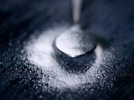 An overfloweing spoon of sugar